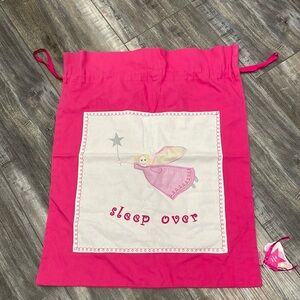 Pink bags with Velcro outer pocket and top pull string closure
